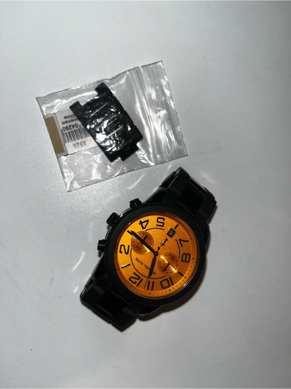 Michael Kors Bold Orange Dial Black Metal Bracelet Watch